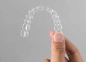 Patient holding clear aligner
