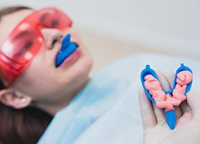 A woman getting fluoride treatment