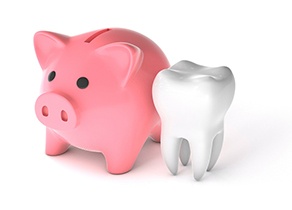 Illustrated piggy bank next to tooth