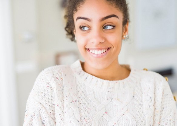 a woman smiling with bright teeth