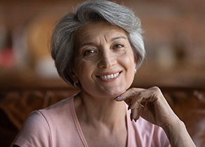 Woman with short gray hair smiling
