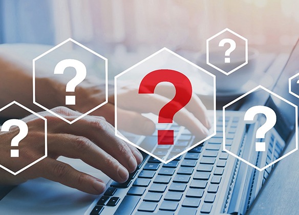 person looking up questions on laptop