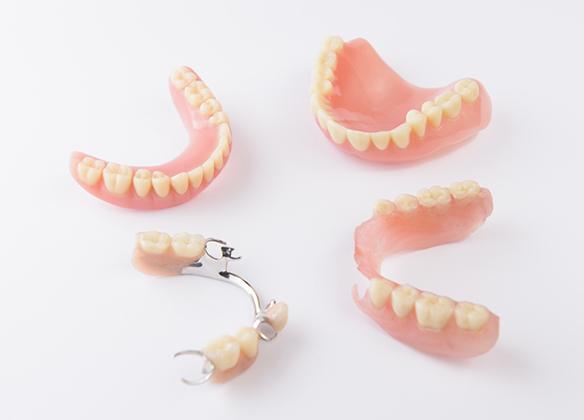A variety of dentures on a white background