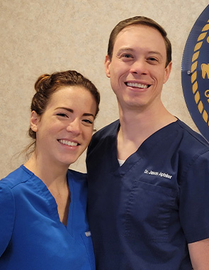 Smiling dentist and dental team member in Wall Township New Jersey