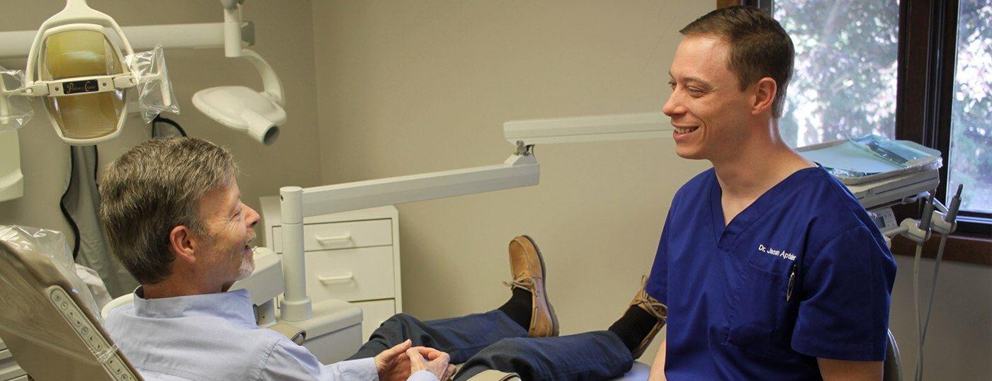 Man in dental chair smiling at dentist in Wall Township