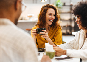 Woman talking to her friends at table
