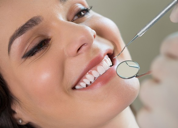 Woman receiving scaling and root planing treatment