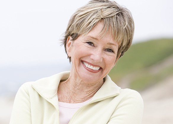 Woman smiling outdoors