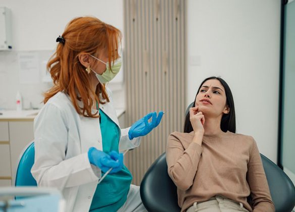 Patient expressing her concerns to her dentist