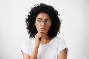 Woman wondering about dental implant recovery