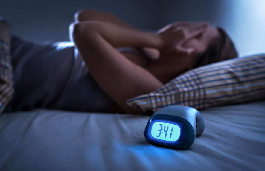 Woman struggling to sleep
